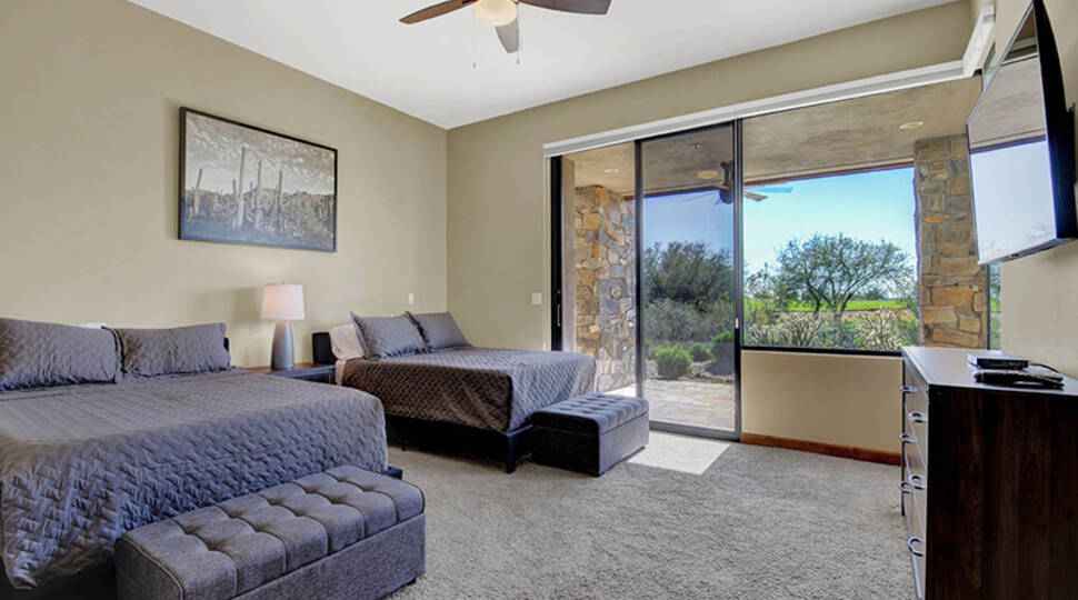 Bedroom inside a Quintero Golf Club casita with desert views